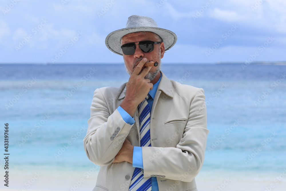 man with a cigar on a tropical island