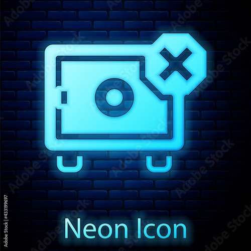 Glowing neon Safe icon isolated on brick wall background. The door safe a bank vault with a combination lock. Reliable Data Protection. Vector