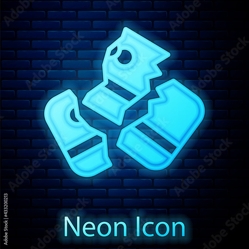 Glowing neon Scissors cutting a credit card icon isolated on brick wall background. Online payment. Cash withdrawal. Financial operations. Shopping sign. Vector