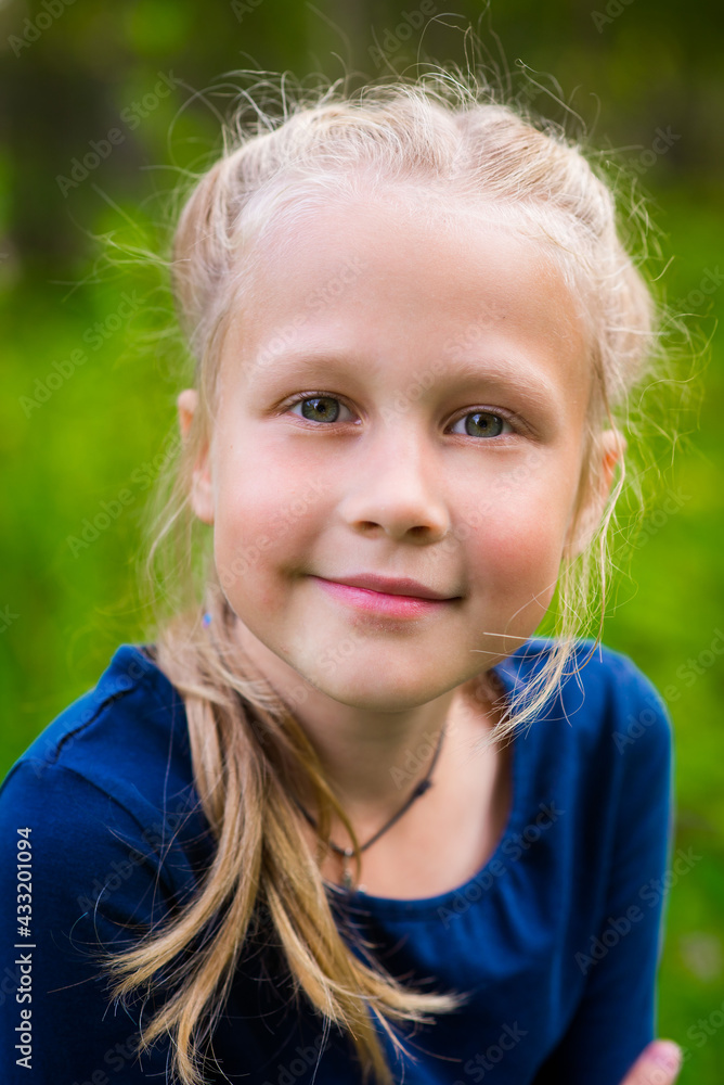 portrait of a cheerful young blonde outdoors happy childhood selective focus portrait of a cheerful young blonde outdoors happy childhood selective focus