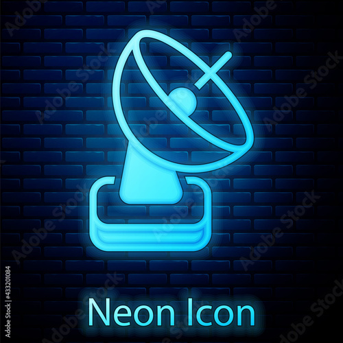 Glowing neon Radar icon isolated on brick wall background. Search system. Satellite sign. Vector