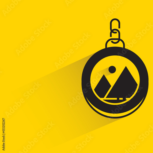 keychain trinket with label on yellow background