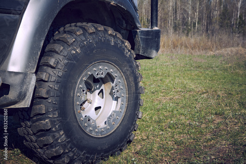 4x4 off-road car wheels on grass. Off-road tire