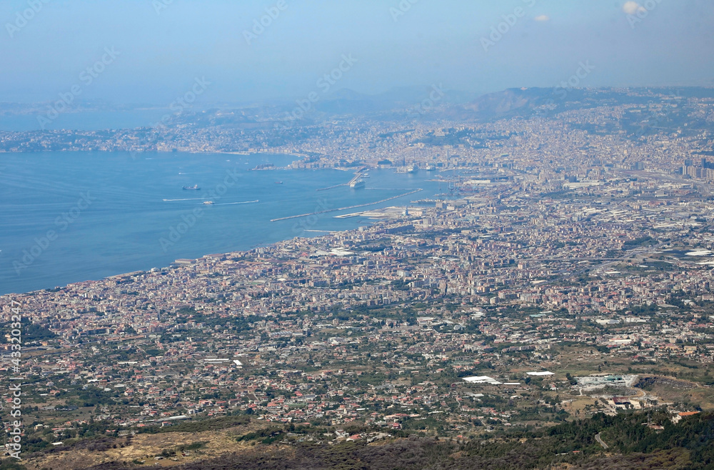 gulf of the great city of Naples in Southern Italy with a cruise ship and many houses near the sea seen from the volcano vesuvius