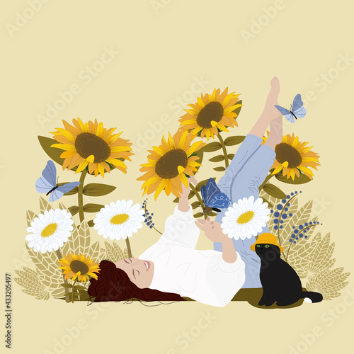 A woman lies in sunflowers and enjoys life. Black cat with a mistress.