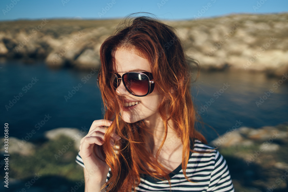 happy traveler wearing sunglasses on vacation in the mountains in nature happy traveler wearing sunglasses on vacation in the mountains in nature