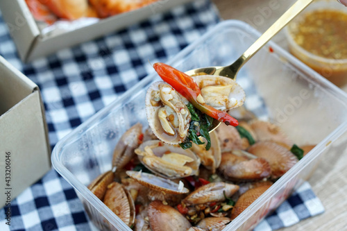 Stir-fried clams with roasted chili paste, Traditional Thai food recipe, Most popular dish in Thailand. photo