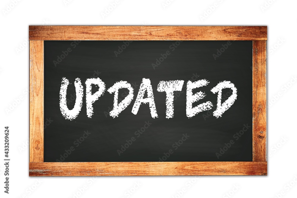 UPDATED text written on wooden frame school blackboard. UPDATED text written on wooden frame school blackboard.