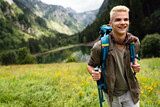 Active healthy man hiking in beautiful nature. Outdoor activity, sport conecpt