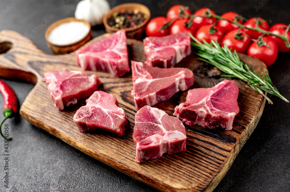 mini raw Beef T-Bone steak on stone background mini raw Beef T-Bone steak on stone background