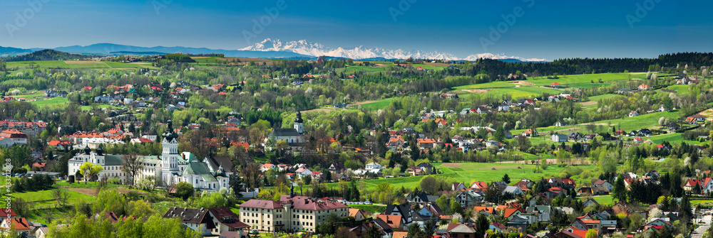 Wide Panoramic View over Monastery and Cityscape of Tuchow,Poland with tatra Mountains Range in Background