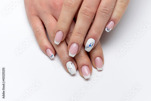 Gel nail design  classic manicure on the form of a bolero with a white track of crystals on long nails. White jacket. Wedding design.