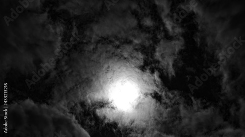 a background with clouds and sun in black and white
