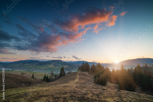 Alpine carpathian valley illuminated by sunset