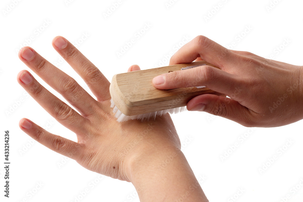 Fototapeta premium One hand is holding a brush to scrub the finger, health care, body cleaning, body cleaning equipment.