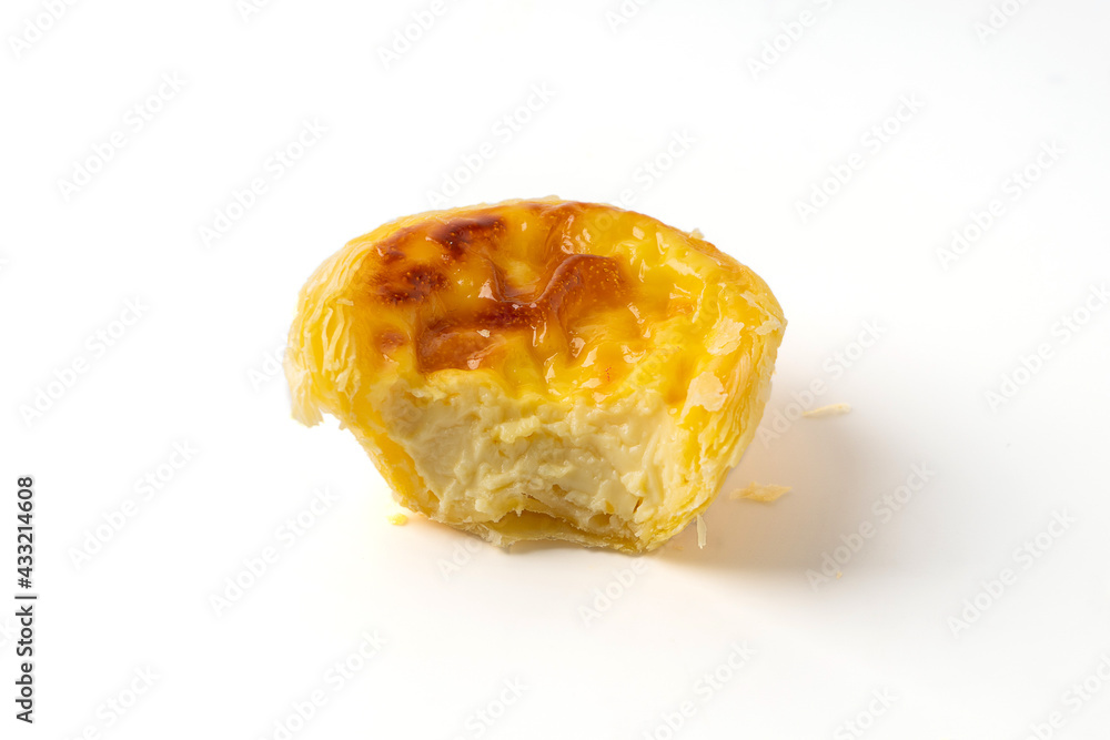 Half of egg tart or egg custard tart isolated on a white background, The main ingredient is outer pie crust. In the middle there is an egg with custard and then baked. Half of egg tart or egg custard tart isolated on a white background, The main ingredient is outer pie crust. In the middle there is an egg with custard and then baked.