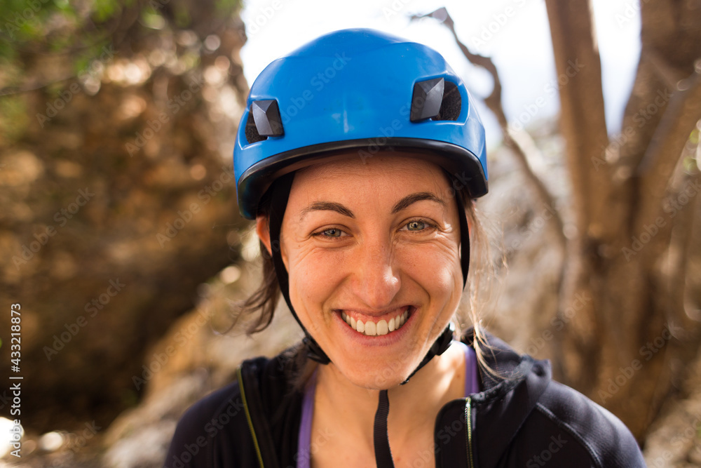 Portrait of smiling woman in safety helmet Portrait of smiling woman in safety helmet