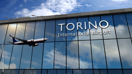 Airplane landing at Torino Italy airport mirrored in terminal