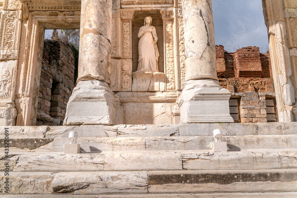 Celsus Library in Ephesus in Selcuk (Izmir), Turkey. Marble statue is Sophia, Goddess of Wisdom, at the Celcus Library at Ephesus, Turkey. The ruins of the ancient antique city. Celsus Library in Ephesus in Selcuk (Izmir), Turkey. Marble statue is Sophia, Goddess of Wisdom, at the Celcus Library at Ephesus, Turkey. The ruins of the ancient antique city.
