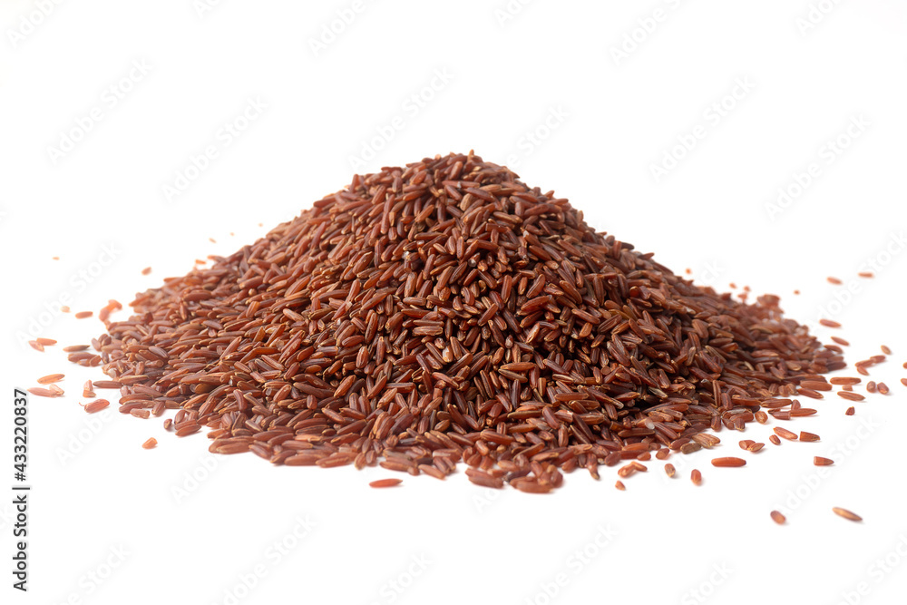 Pile of red rice (brown rice) isolated on a white background, Whole grain rice with lots of fiber and benefits, unpolished rice. Pile of red rice (brown rice) isolated on a white background, Whole grain rice with lots of fiber and benefits, unpolished rice.