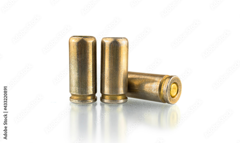 Pistol bullets isolated on white background, 9mm shells for a gun Pistol bullets isolated on white background, 9mm shells for a gun