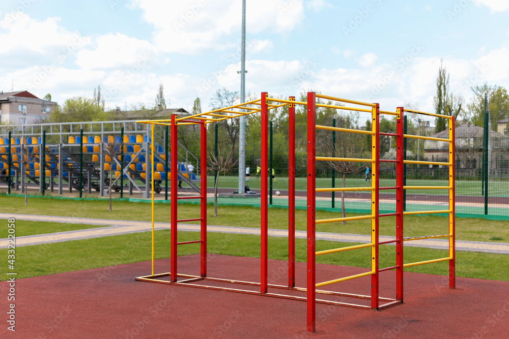 Fototapeta premium Red with yellow sports complex on the court