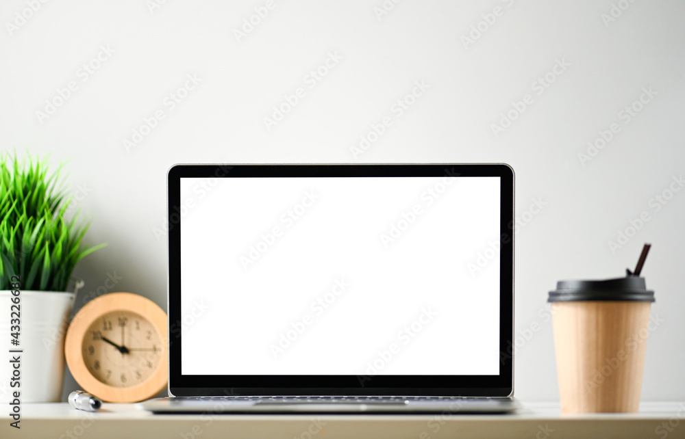 Fototapeta premium Laptop computer with blank screen in office