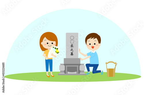 お墓参りをする夫婦
