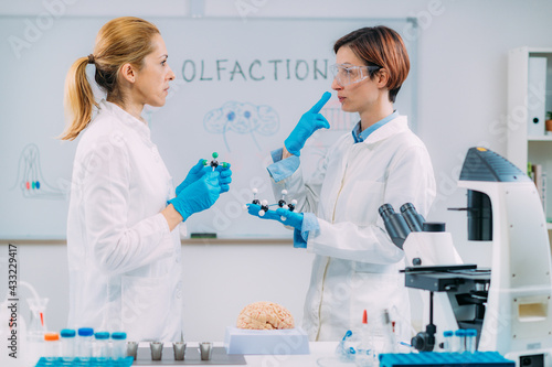 Olfaction. Female Scientists Examining Smells.