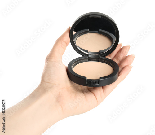 Woman holding black pocket powder with mirror on white background, closeup. Cosmetic product