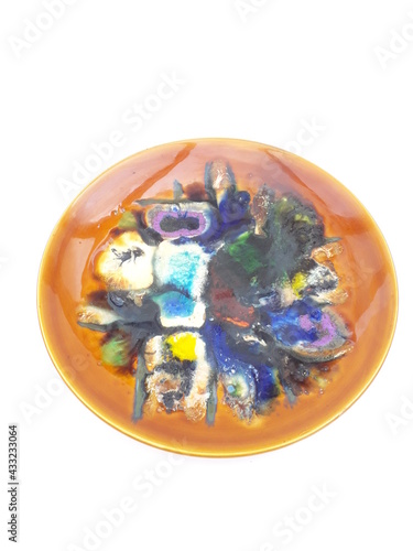 Mid-century modern ceramic wall plate with colorful abstract pattern isolated