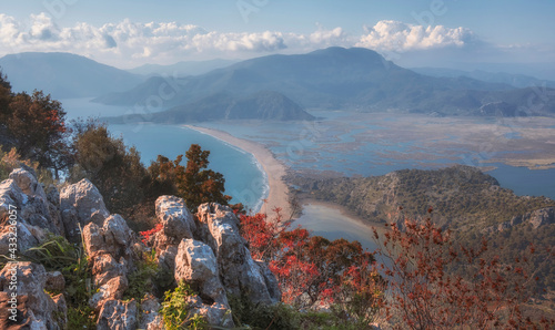Fototapeta Naklejka Na Ścianę i Meble -  A beautiful panoramic view of the river delta and the town of Dalyan, Iztuzu beach and the surrounding mountains from view point. Mugla Province Turkey in autumn time