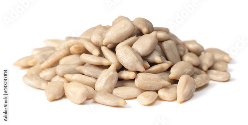 pile of peeled sunflower seeds isolated on white background