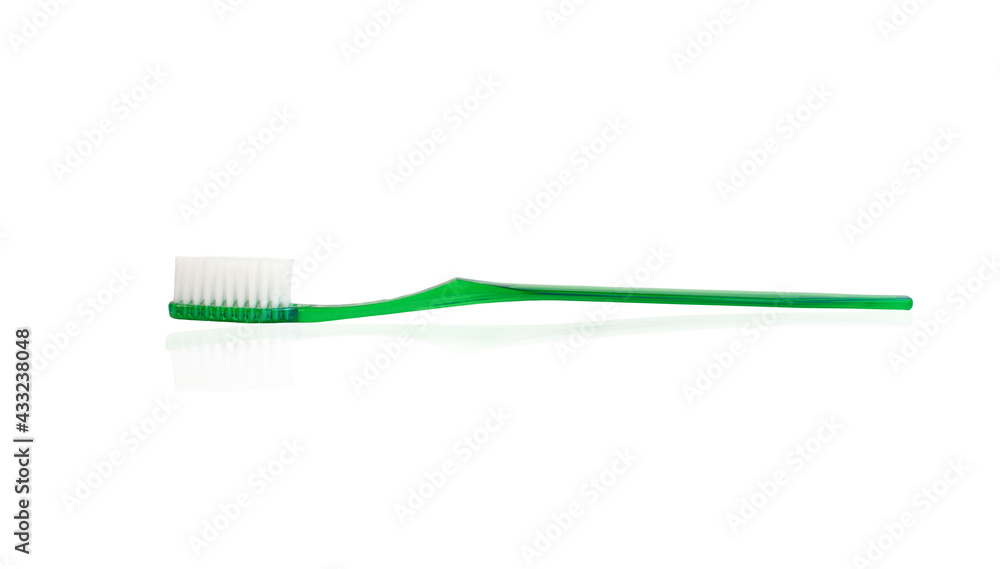 green plastic toothbrush on white background green plastic toothbrush on white background
