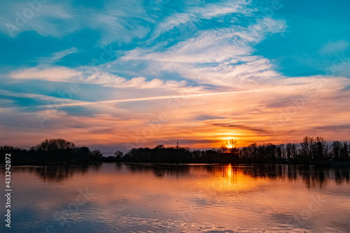 Beautiful sunset with reflections near Plattling, Isar, Bavaria, Germany