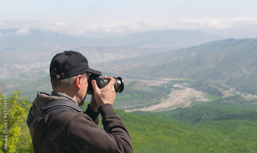 Photographer traveler with camera and backpack Photographer traveler with camera and backpack