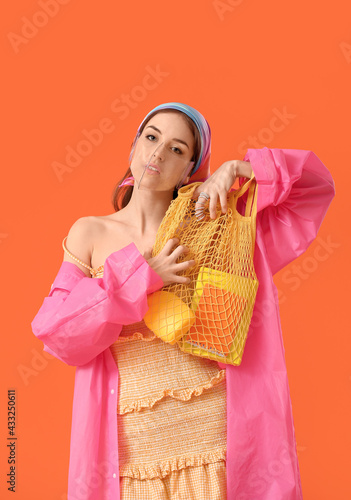 Fashionable young woman wea...