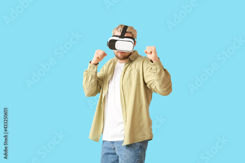 Young man with VR glasses o...