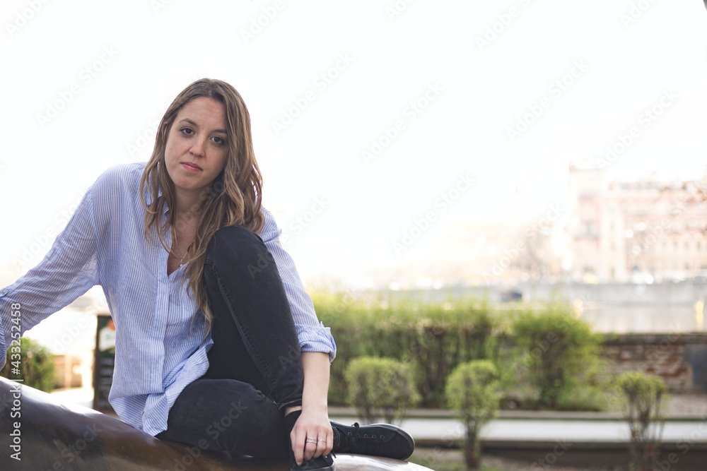 Fototapeta premium Portrait of a young girl sitting on vacation
