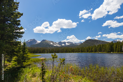 Bierstadt Lake with blue sky and white clouds in background in Rocky Mountain National Park, Colorado