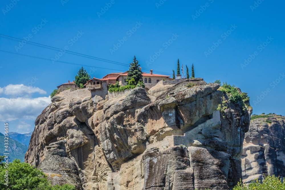 Fototapeta premium Holy Trinity Monastery (Agia Trias) - Eastern Orthodox monastery at the complex of Meteora monasteries. Peneas Valley, Greece. It situated at the top of a rocky precipice over 400 meters high.