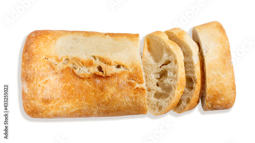 Italian ciabatta bread. Sliced loaf of bread isolated on white. Top view.