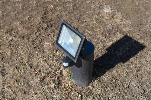 Foto Outdoor diode floodlight with motion and light sensor, modern