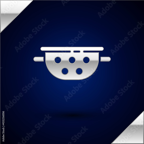 Silver Kitchen colander icon isolated on dark blue background. Cooking utensil. Cutlery sign. Vector