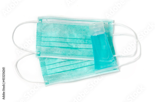 Flatlay(top view) or overhead Alcohol hands gel and hygienic face mask with isolated on white background as personal protective equipment coronavirus prevention medical surgical