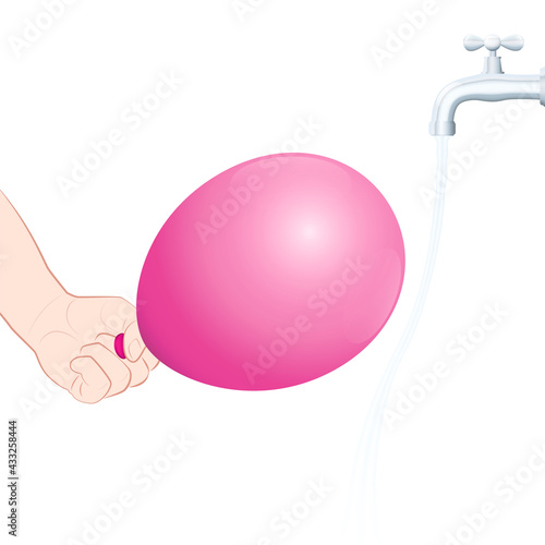 Bending water caused by a charged balloon. Static attraction, physical experiment. Set the tap running gently, rub the balloon on your hair, move it near to the stream and the water is attracted.
