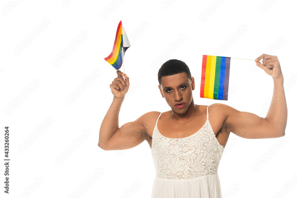 african american transgender man looking at camera while holding lgbt flags isolated on white african american transgender man looking at camera while holding lgbt flags isolated on white