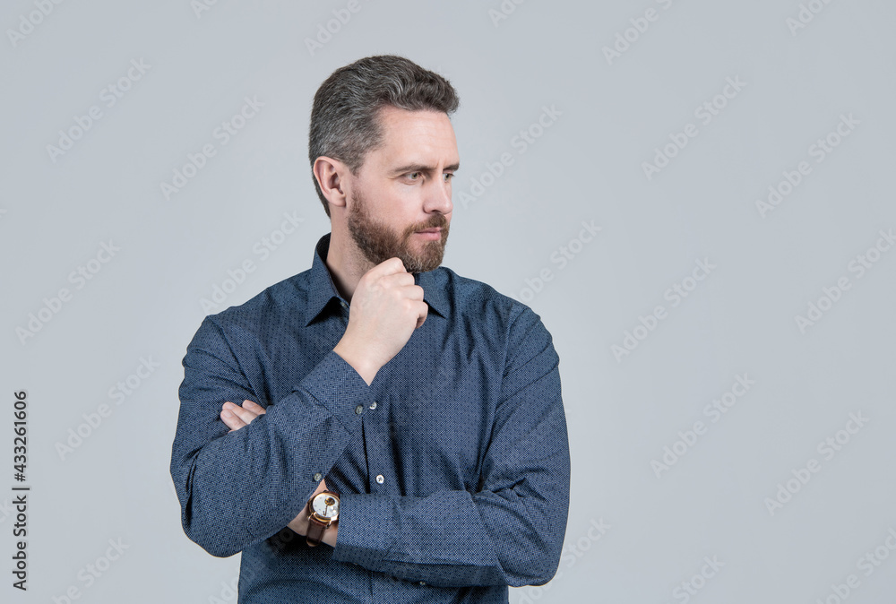 Unshaven man with stylish beard hair shape look serious in casual style shirt, barbering, copy space Unshaven man with stylish beard hair shape look serious in casual style shirt, barbering, copy space