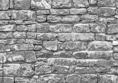 Old grungy clear retro brick wall of ancient city. Uneven soft pitted peeled surface brickwork of cellar worn. Ruined solid bumpy stiff blocks. Hard simple ragged holes brickwall for 3D grunge design