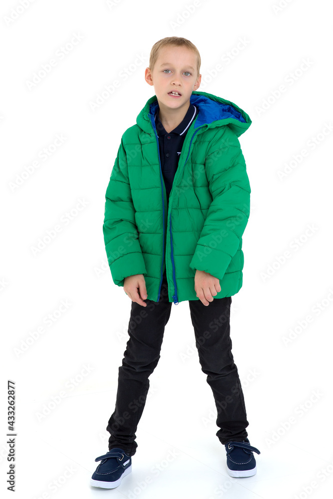 Fototapeta premium Smiling boy in unbuttoned green winter jacket